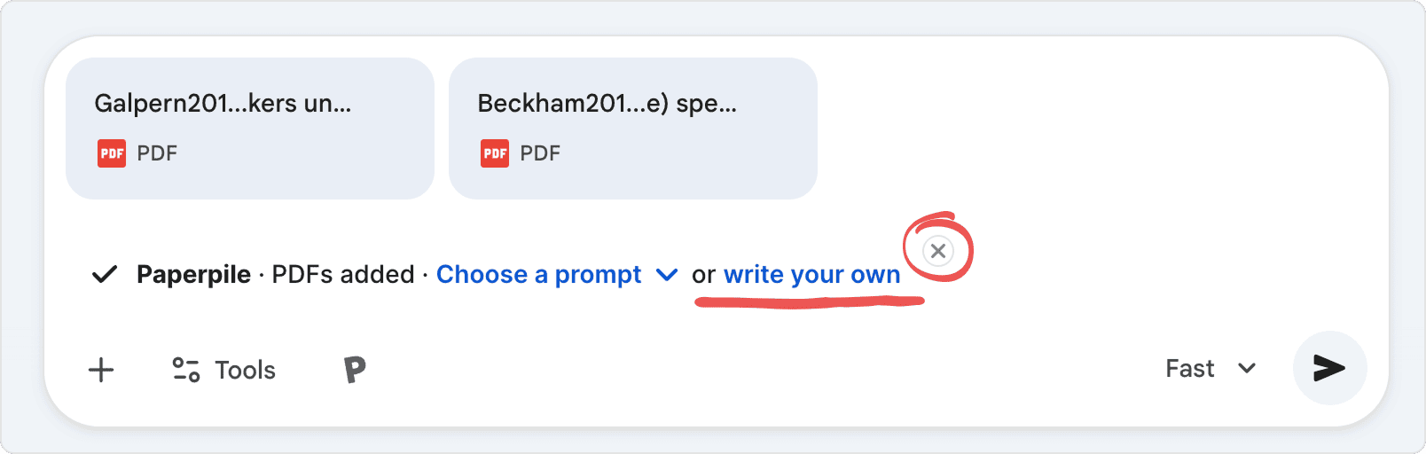 Two PDF attachments in a chat, above a Paperpile chip reading “PDFs added · Choose a prompt or write your own”, with “write your own” underlined and the chip’s remove button circled.